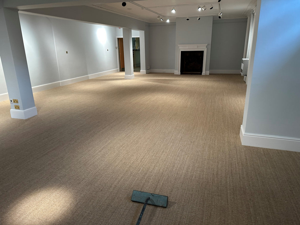 Fibre Flooring sisal carpet double stick installation at Dreweatts auction house in Newbury art gallery